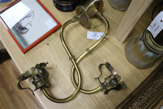 A pair of brass wall lights and a similar ceiling light with vaseline glass shades